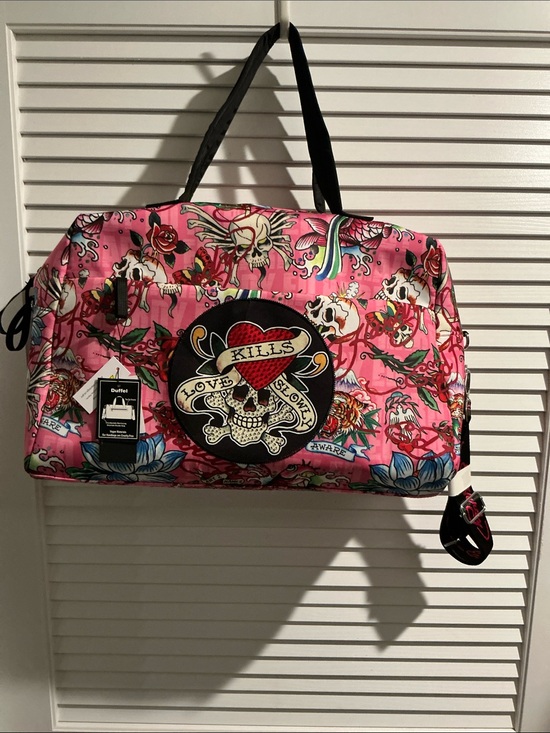 Ed Hardy Handbags - NWT Ed Hardy Weekend Traveler with Convenient Suitcase Slide and zipper closure.